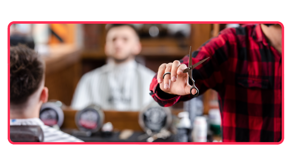 Un barbero profesional maneja con precisión sus herramientas de corte esenciales, una habilidad clave que perfeccionarás a lo largo de este curso gratuito